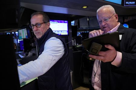 Wall Street ends mostly lower as chipmakers ease; inflation data ahead