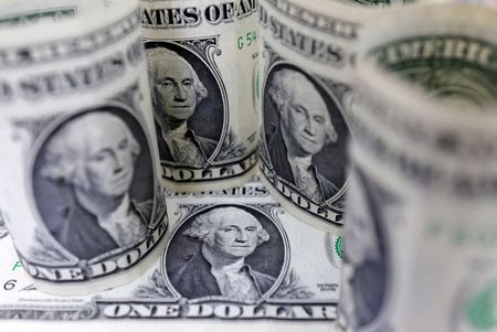 Dollar hits two-week low, moves lower against yen